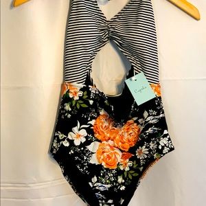 New one piece stripe and floral print bathing suit with tags. Never worn. Size S